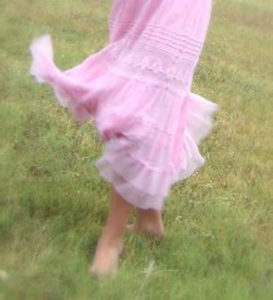 little girl running in pink dress
