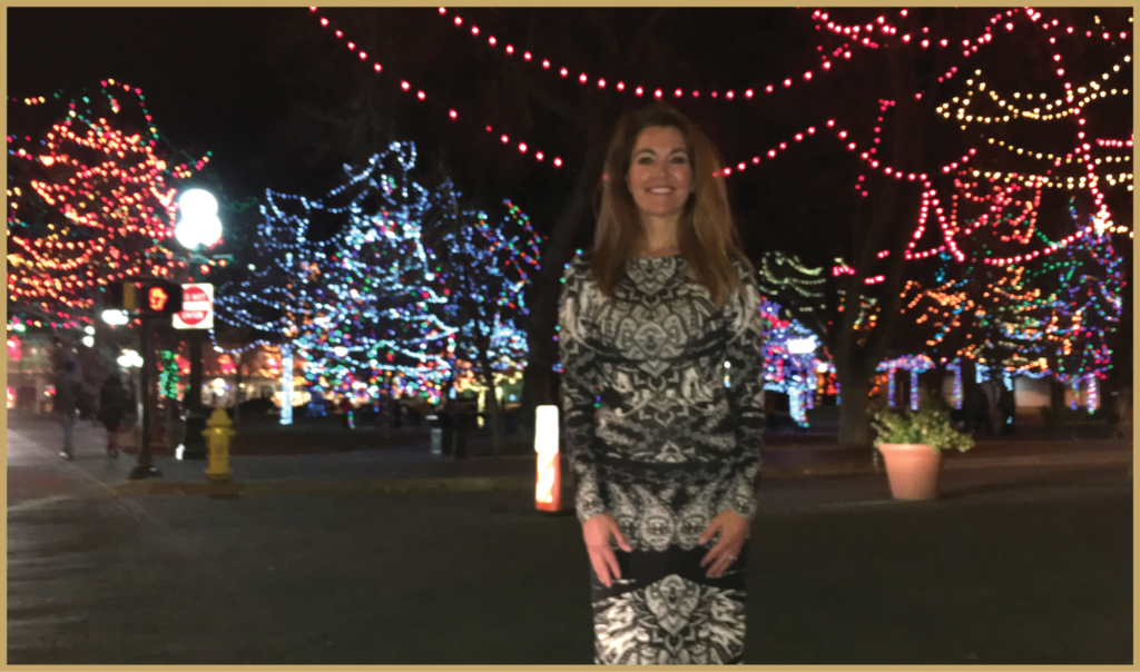 Michelle Bersell surrounded by Christmas Lights